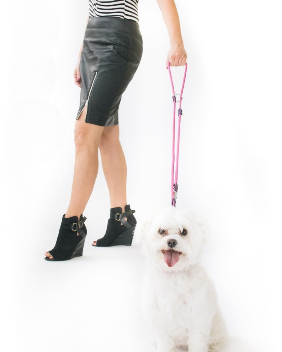 Woman walking dog with adjustable eco-leather leash