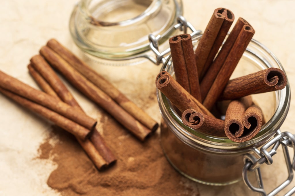 Cinnamon Sticks in a jar and cinnamon powder
