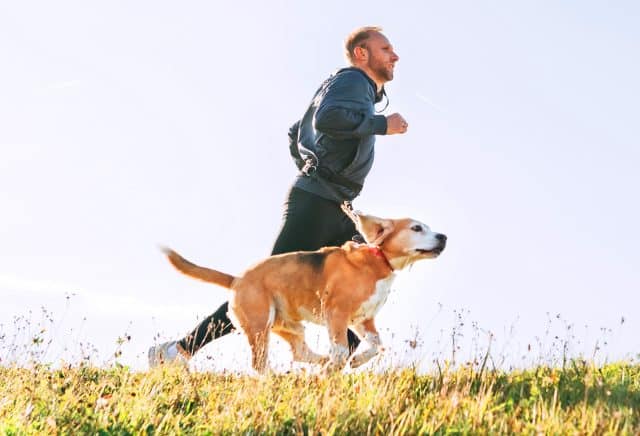 man running with his dog