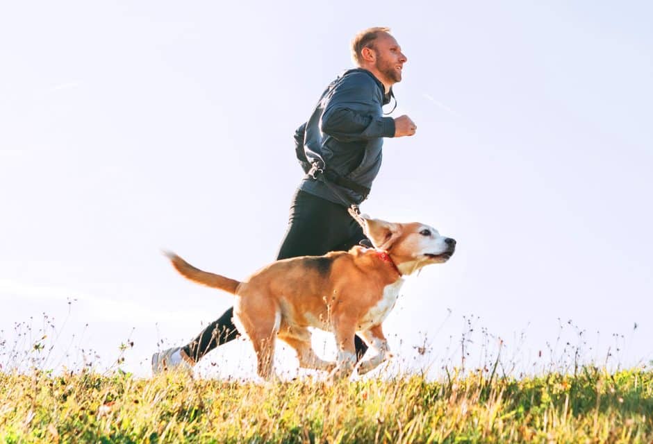 man running with his dog