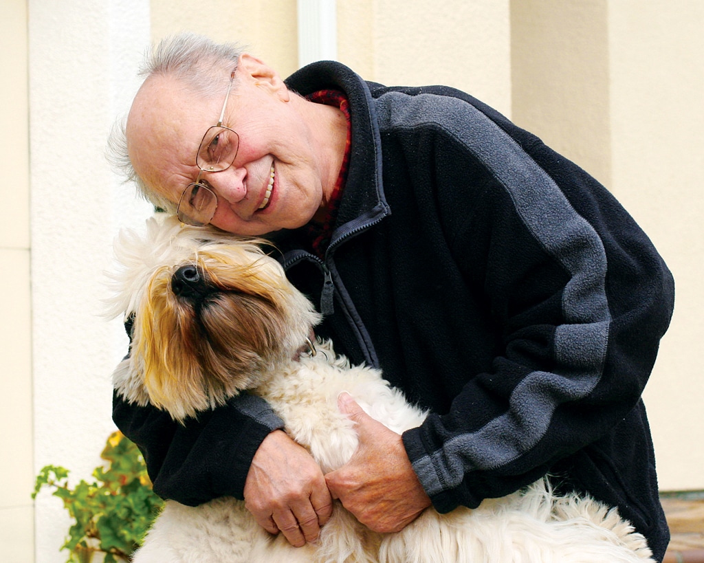 elderly man with his dog