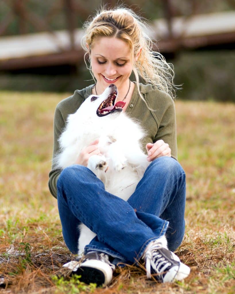 American Eskimo dog and owner